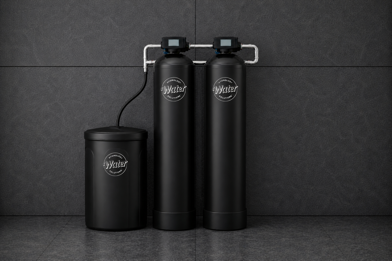 Image of water softener tank, water filtration tank and brine tank installed on a water loop.